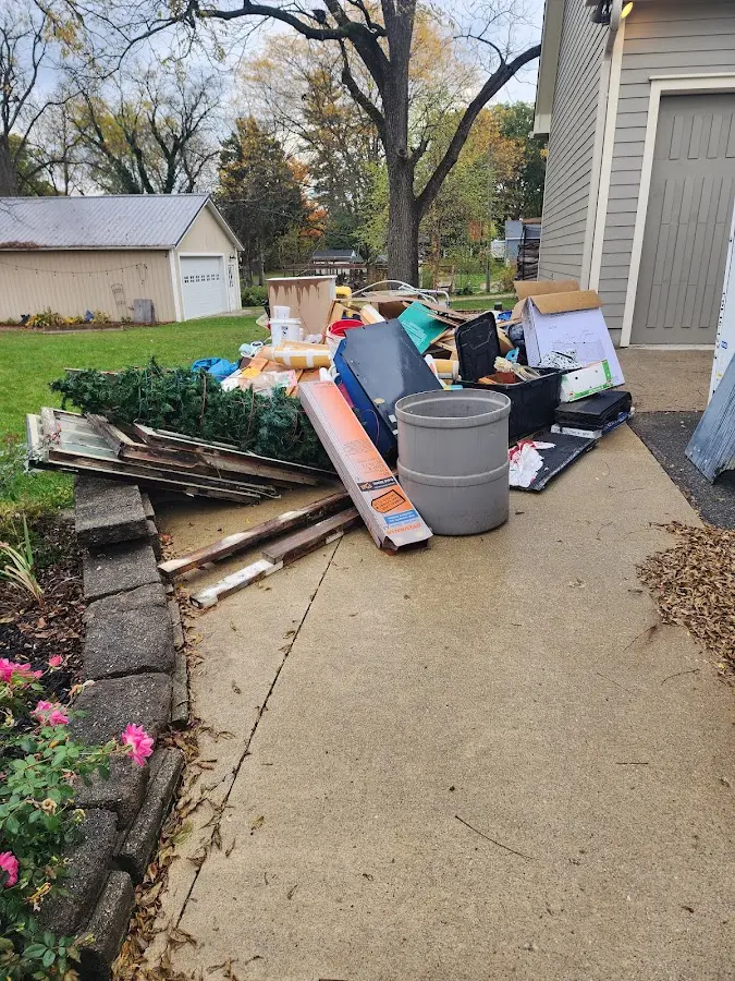 Dumpster being loaded with debris for 3 Yard Dumpster Rental in Kingsville